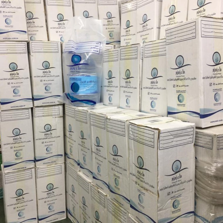 bundle of Aab-e-Zam Zam water in warehouse at Al Madni Traders. 